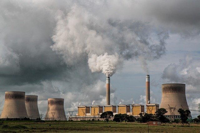 smoke stack polluting the skyline from a factory