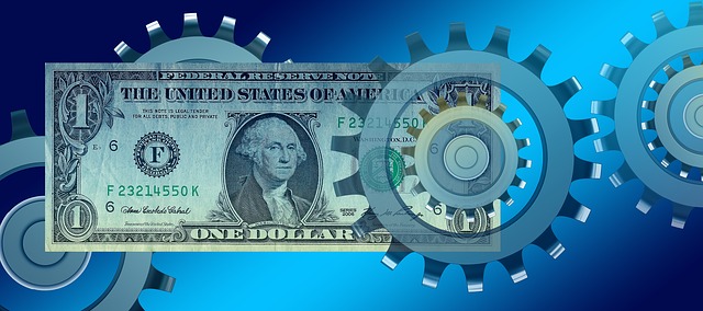 a dollar superimposed with gears on a blue background