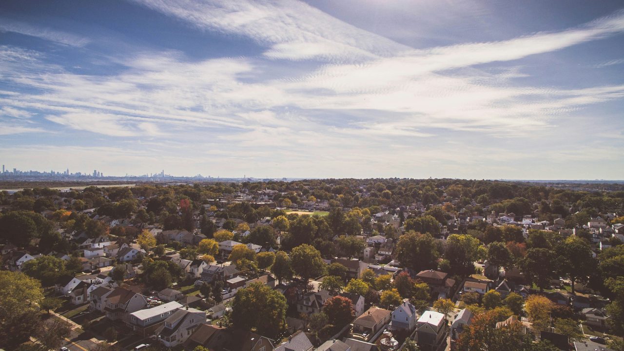 aerial view of a suburb with a half sky, half ground view