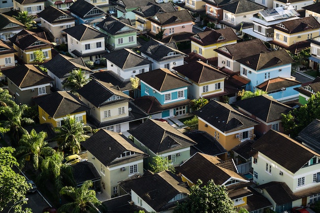 birds eye view of a rural neighborhood with a blue house in the center