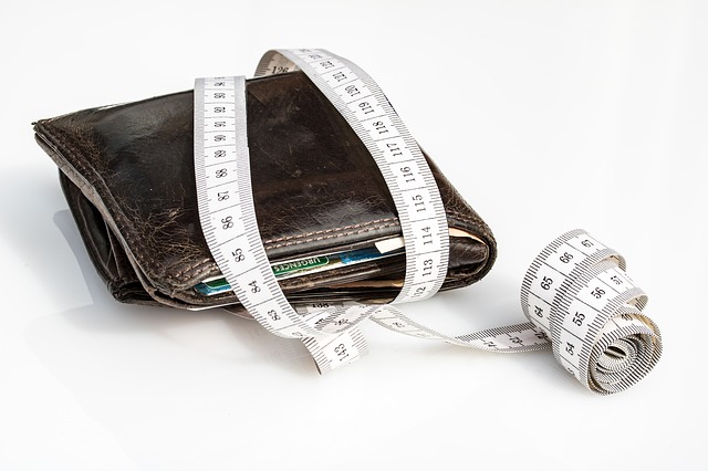 a tape measure wrapped around a leather wallet